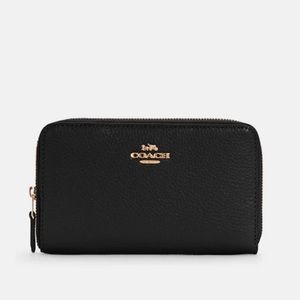 Coach brand wallet, black leather, never been used! Tags and original packaging.